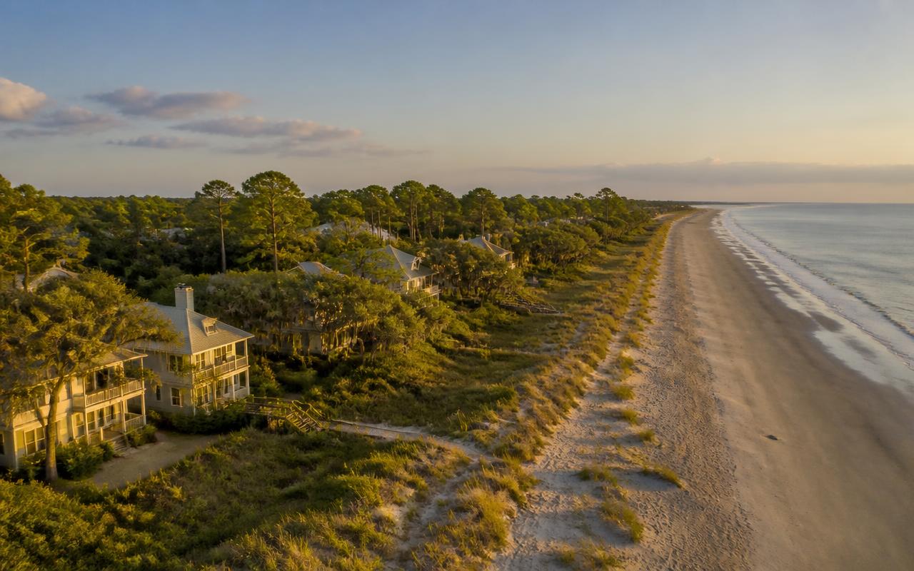 Hilton Head Island South Carolina beachfront homes among pines and sea oats at sunset